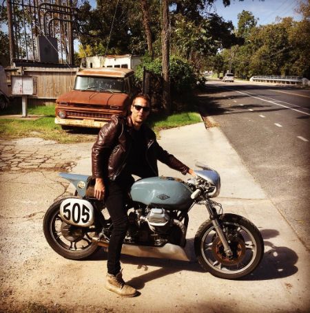 Taylor Kitsch posed on a bike that he found cool.